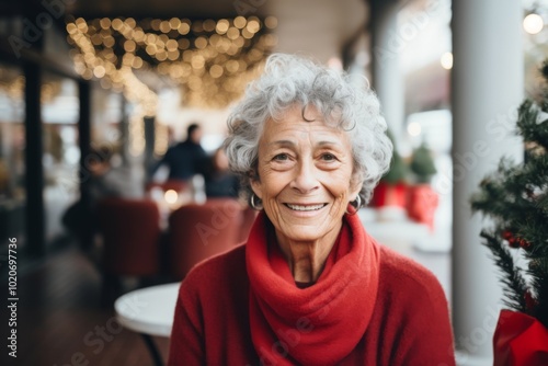 Portrait of a elderly Caucasian woman smiling in front of nursing home during Christmas