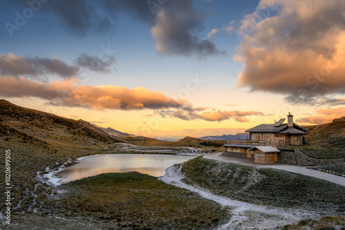 Passo Rolle with lake and Baita Segantini hut photo