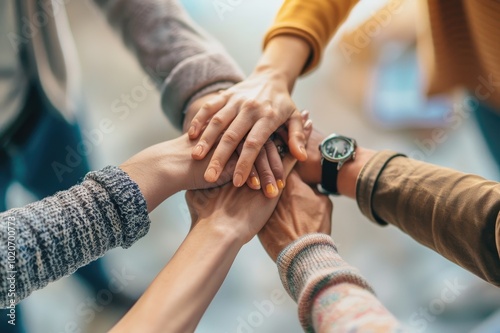 Happy mixed colleagues team people holding hands together. Business teamwork results are motivated by business success victory loyalty unity concept, good corporate relations, and team building