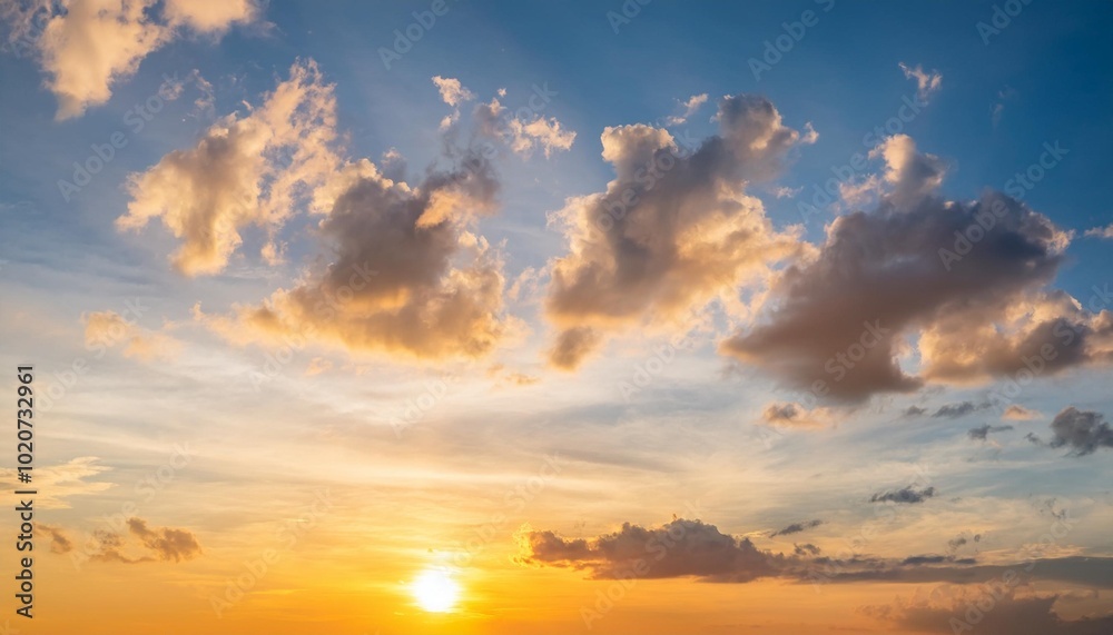 Fototapeta premium sunset sky clouds vertical in the evening on summer season with orange yellow sunlight on blue sky background