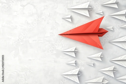 A bold red paper airplane leads a group of white ones, symbolizing leadership and innovation against a minimalist background.