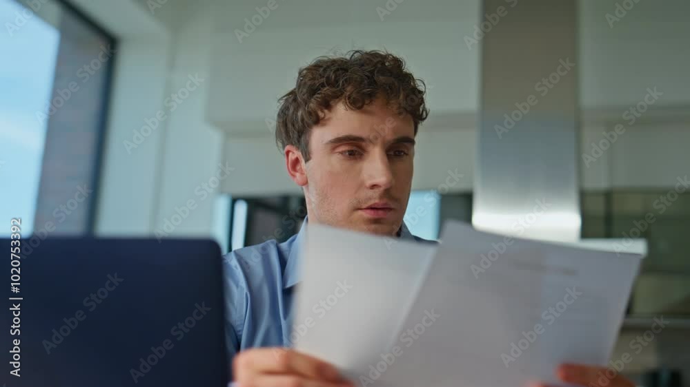 Overloaded accountant working papers sitting workplace with laptop closeup. Overloaded accountant working papers sitting workplace with laptop closeup.