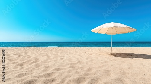 Serene Beach Scene with Umbrella and Blue Sky