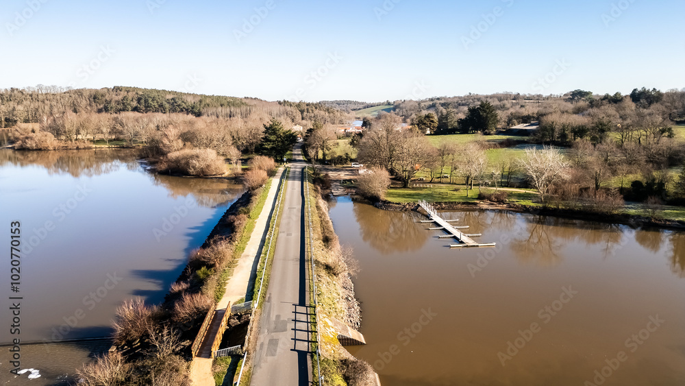 Bridge passing over the Jaunay lake in La Chappelle-Hermier, France