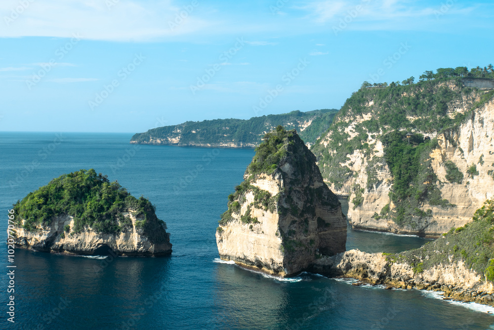 The beautiful sandy beach (Diamond beach) with rocky mountains and clear water in Nusa Penida, Bali, Indonesia The beautiful sandy beach (Diamond beach) with rocky mountains and clear water in Nusa Penida, Bali, Indonesia