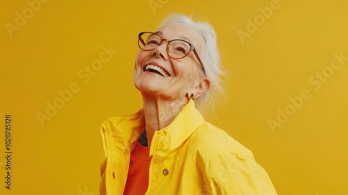 Smiling Senior Woman in Yellow Jacket