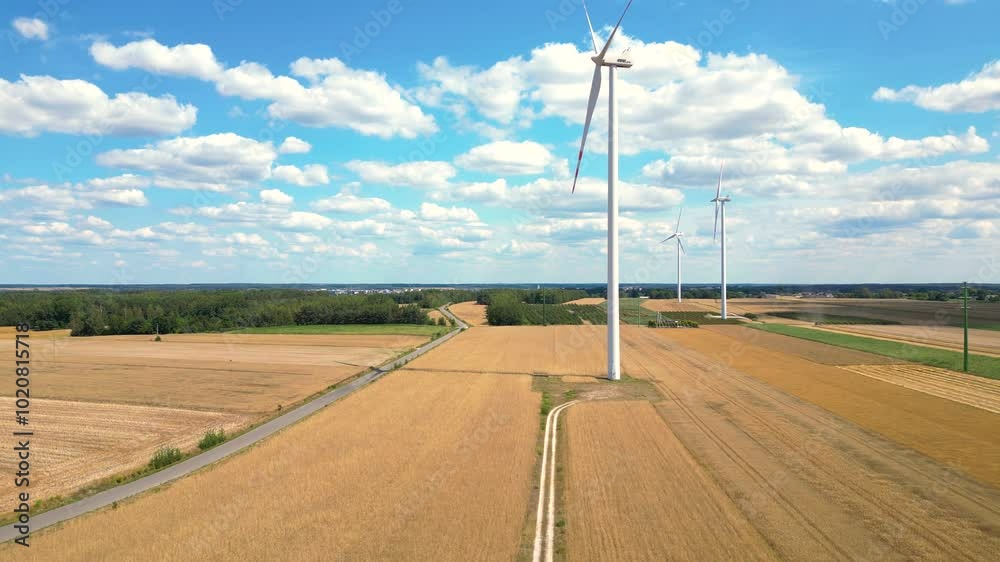 Exploring wind turbines in a scenic agricultural landscape during the sunny afternoon in midwestern USA Exploring wind turbines in a scenic agricultural landscape during the sunny afternoon in midwestern USA