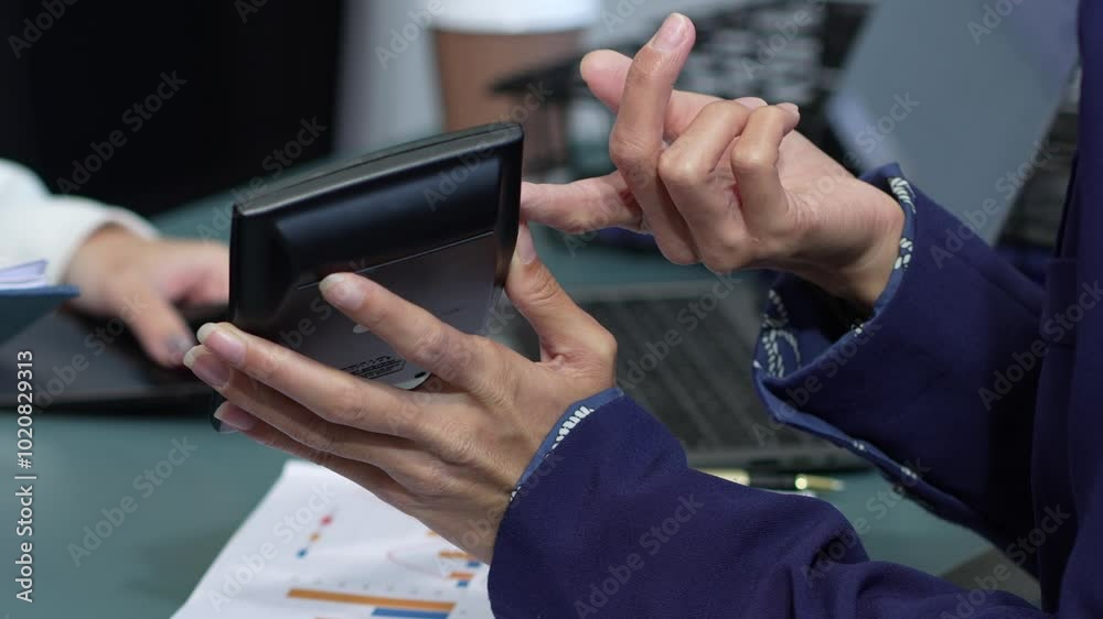 business woman hand using calculator to calculate home finance, accounting with laptop computer on table, budget management, monthly expenses. Doing finance, budgeting and tax calculation. business woman hand using calculator to calculate home finance, accounting with laptop computer on table, budget management, monthly expenses. Doing finance, budgeting and tax calculation.