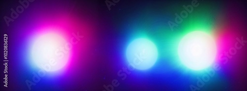 A colorful light display with four different colored lights. The lights are purple, blue, green, and white