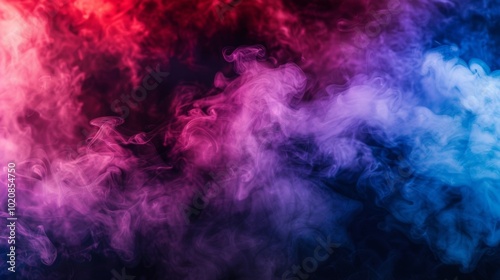 Dramatic smoke and fog in contrasting vivid red, blue, and purple colors. Vivid and intense abstract background or wallpaper.