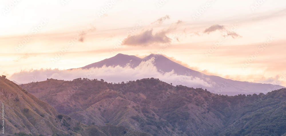 Fototapeta premium amazing highland view from above to a canyon and valley between mountains and green hills, cloudy sunset landscape of beautiful highland