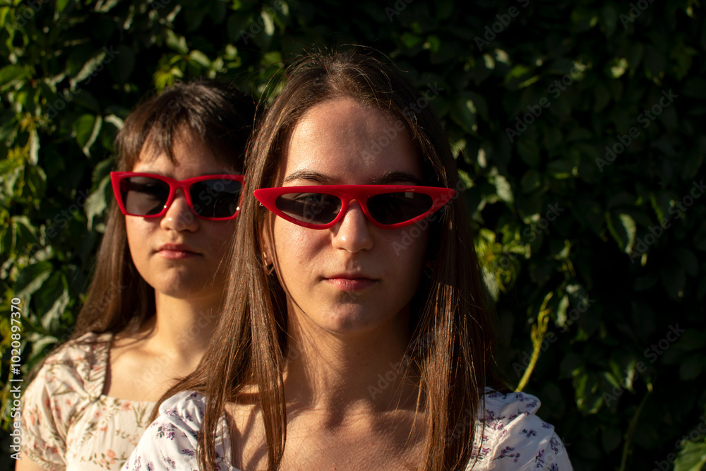 Portrait of a two young woman in sunglasses Portrait of a two young woman in sunglasses