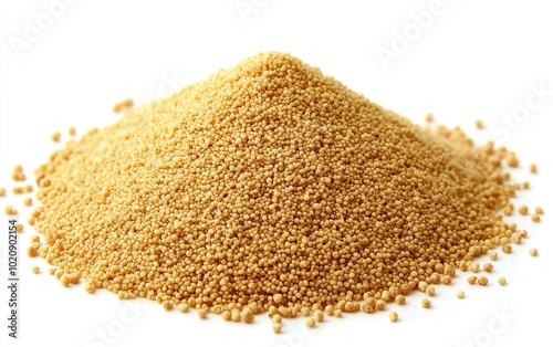 Fine yellow mustard seeds arranged in a small mound on a clean white background showcasing their texture and color