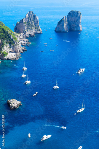 Fototapeta Naklejka Na Ścianę i Meble -  Famous Faraglioni cliffs and Capri island coast, Italy, retro toned