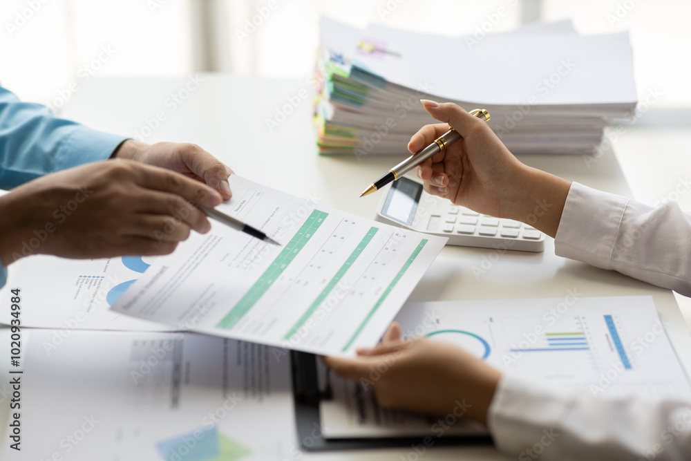 Fototapeta premium Meeting to discuss market situation analysis using financial charts in business reports. Financial planning consultant and investment portfolio analysis.