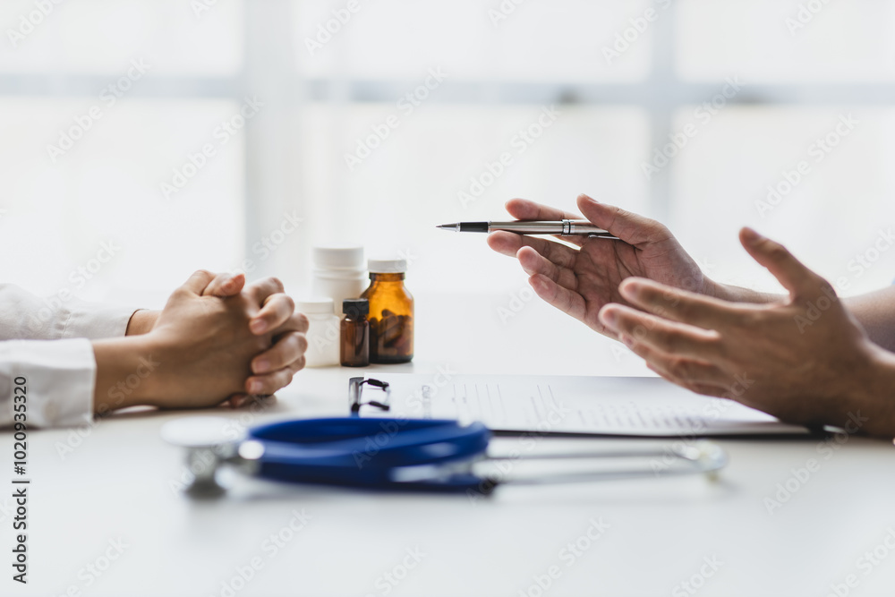 Doctor explaining diagnosis to patient and notes. Doctor and female patient discussing in examination room at hospital. Medicine and healthcare concepts. Doctor explaining diagnosis to patient and notes. Doctor and female patient discussing in examination room at hospital. Medicine and healthcare concepts.
