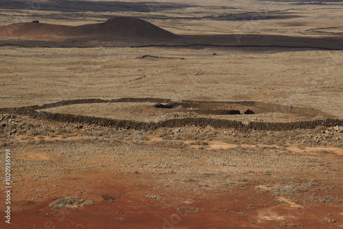 desertic landscape of volcano and caldera on the sea side