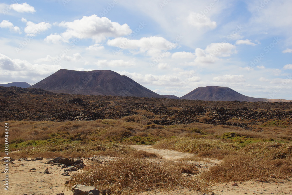 desertic landscape of volcano and caldera on the sea side desertic landscape of volcano and caldera on the sea side