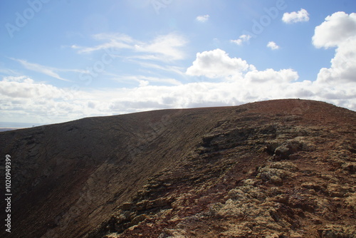 desertic landscape of volcano and caldera on the sea side
