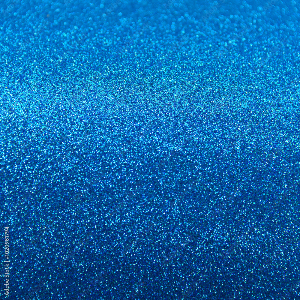 Obraz premium Glamorous glittering Background texture with sequins. Saturated blue color