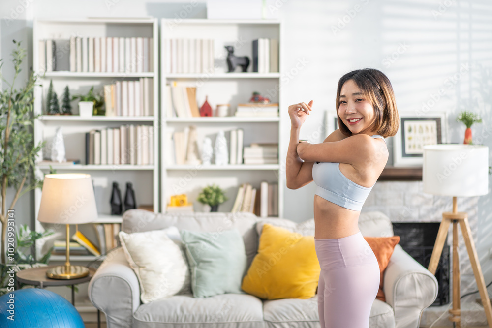 Portrait of sport slim fit strength asian woman training in sportswear relax and practicing yoga, fitness, exercise, wellness, workout, sport at home.Diet concept.Fitness and healthy lifestyle Portrait of sport slim fit strength asian woman training in sportswear relax and practicing yoga, fitness, exercise, wellness, workout, sport at home.Diet concept.Fitness and healthy lifestyle