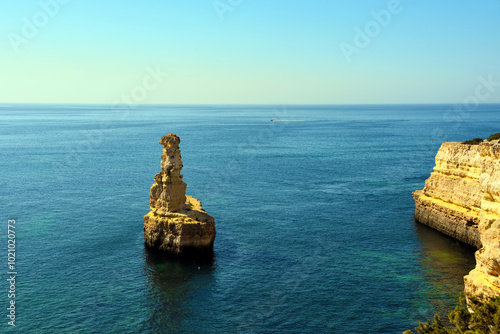 natural rock called yellow submarine lagoa portugal photo