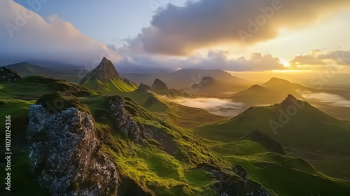 Quiraing Mountains Sunset at Isle of Skye, Scotland, United Kingdom: A breathtaking sunset view over the Quiraing mountains on the Isle of Skye, showcasing the rugged terrain and vibrant colors