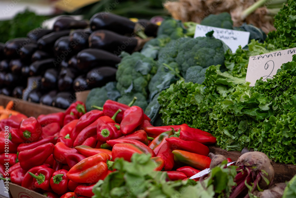 Fresh vegetables displayed on a farmer's market counter Fresh vegetables displayed on a farmer's market counter