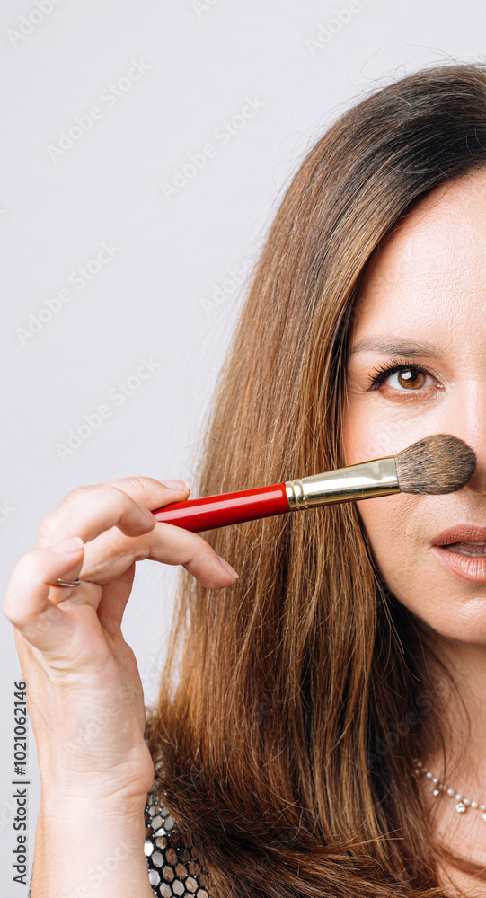 portrait of makeup artist on white background