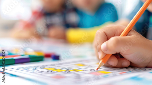 Child solving sudoku puzzle with pencil in classroom setting. photo