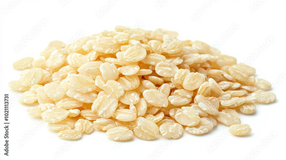 This image shows a pile of flattened, light-colored grains photographed on a white background, highlighting their subtle texture and natural appearance. This image shows a pile of flattened, light-colored grains photographed on a white background, highlighting their subtle texture and natural appearance.