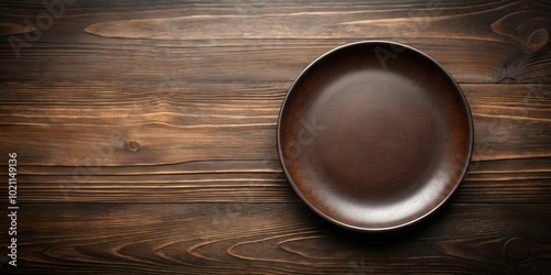 Empty Brown Plate on Rustic Wooden Tabletop with Copy Space for Food Photography