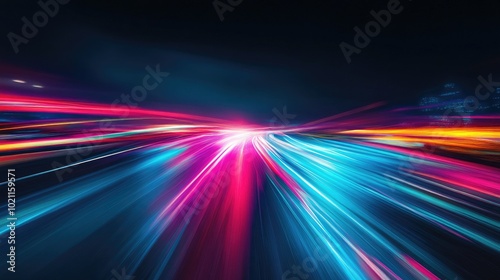 Vivid light trails of blue and pink hues create a dynamic, energetic scene of night traffic.