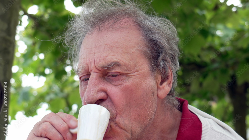 Elderly man enjoying a small cup of coffee outdoors, surrounded by lush greenery. a moment of relaxation and contentment, highlighting the simple pleasures of life Elderly man enjoying a small cup of coffee outdoors, surrounded by lush greenery. a moment of relaxation and contentment, highlighting the simple pleasures of life
