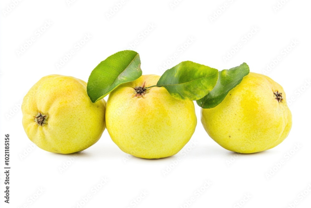 A cluster of three yellow apples with green leaves, ideal for food or nature scenes A cluster of three yellow apples with green leaves, ideal for food or nature scenes