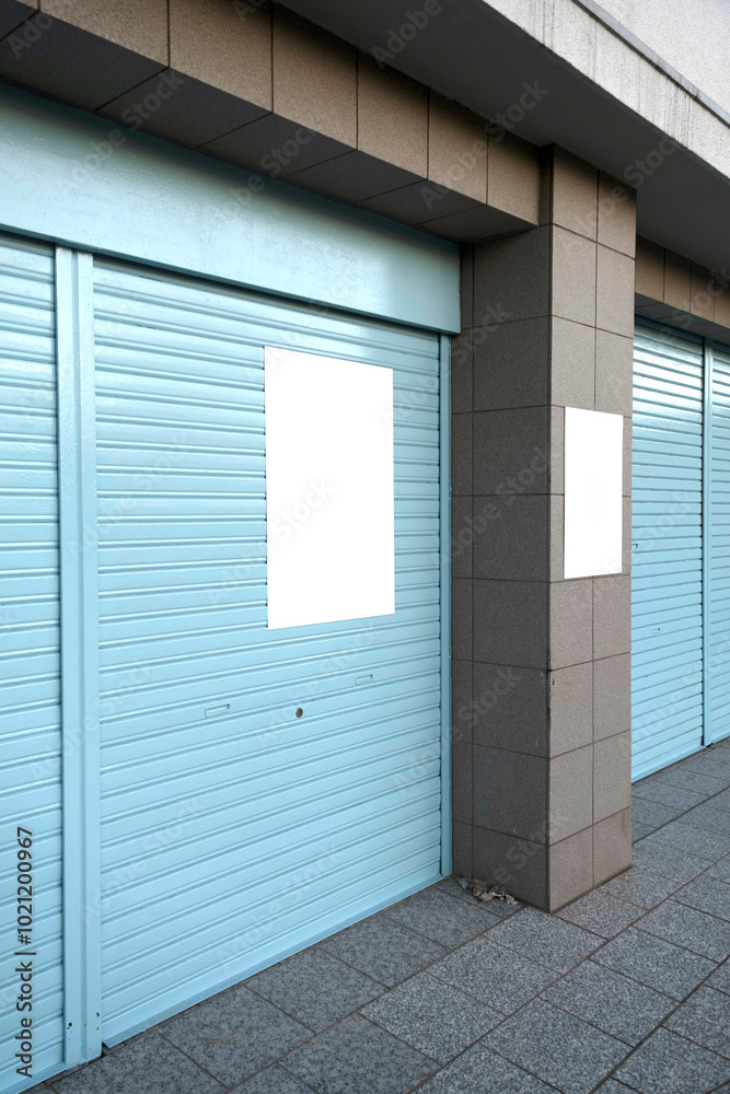 Fototapeta premium white poster mockup on blue wall in the street