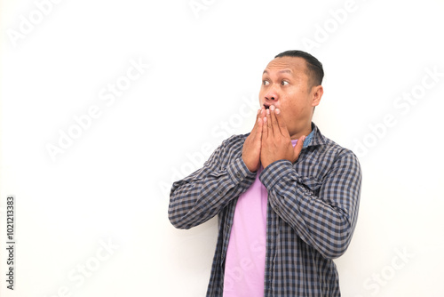 shocked face or shocked expression of an Asian man isolated on a white background