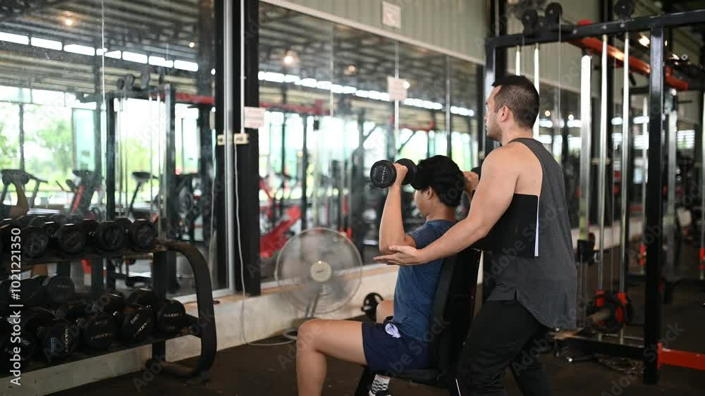 A Personal Trainer Guiding a Client through a Fitness Routine in a Gym - Emphasizing Health, Strength, and Wellness in a Supportive Environment A Personal Trainer Guiding a Client through a Fitness Routine in a Gym - Emphasizing Health, Strength, and Wellness in a Supportive Environment