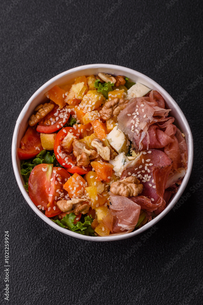 Appetizing salad with prosciutto, pumpkin, cheese and tomatoes Appetizing salad with prosciutto, pumpkin, cheese and tomatoes