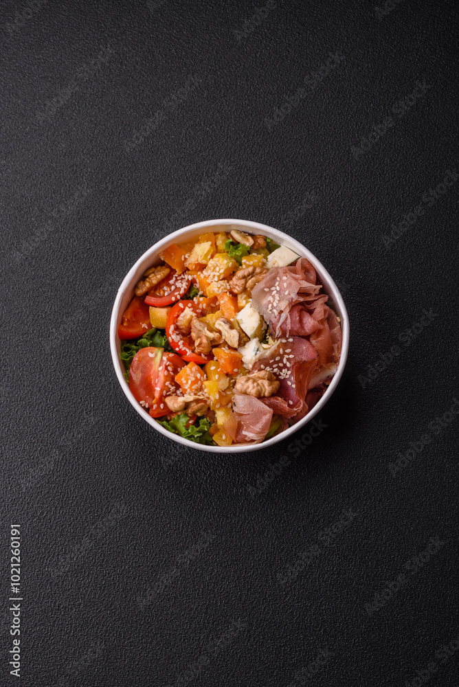 Appetizing salad with prosciutto, pumpkin, cheese and tomatoes Appetizing salad with prosciutto, pumpkin, cheese and tomatoes