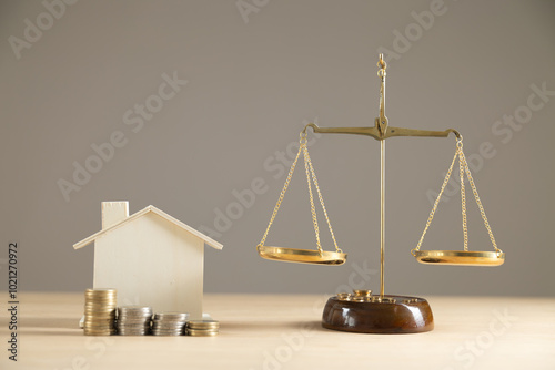 Judge auctions and the real estate legal system House model and gavel with icons on a wooden table Laws governing foreclosures and bankruptcies, debts or liens, divorces, inheritances, balance of law
 photo