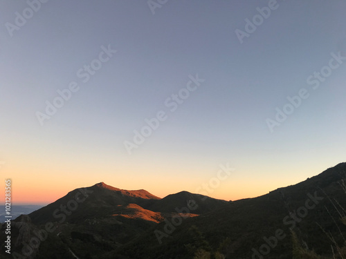 sunset under mountains