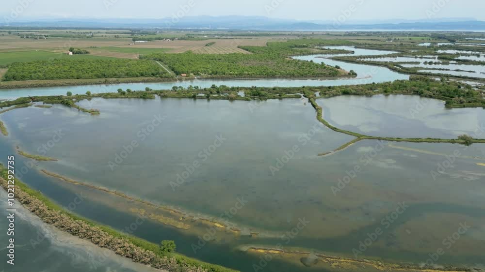 Grado Lagoon seen from above. Between waters, islands and uncontaminated nature Grado Lagoon seen from above. Between waters, islands and uncontaminated nature