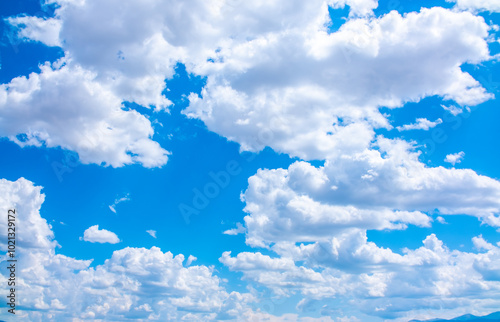 Fototapeta Naklejka Na Ścianę i Meble -  Panoramic view of blue sky with fluffy clouds. Beautiful landscape with beautiful clouds. Clouds close-up.