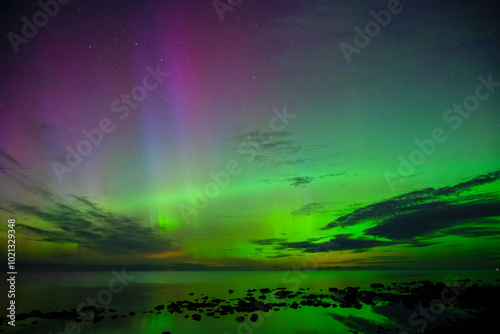 Northern light dancing above the Baltic Sea in Sweden