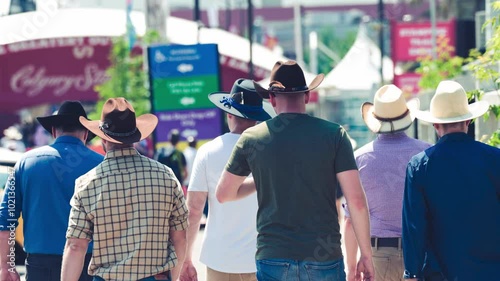 Group of men walking in Stampede Park, Calgary - Alberta
