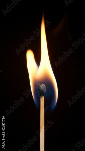 burning match on black background