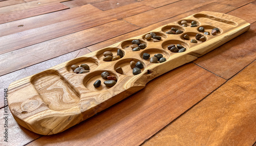 Handcrafted Wooden Mancala board with Colorful Stone Seeds - A boardgame of Arab, Muslim, African, and Asian Heritage Spread Through Migration