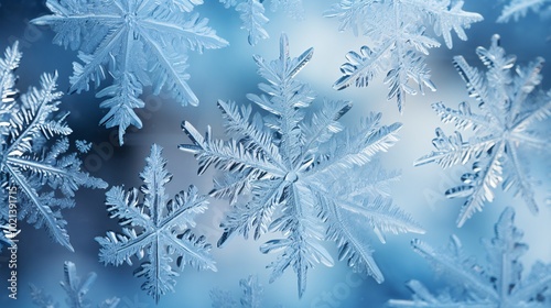 Snowflakes forming intricate patterns on a frozen window