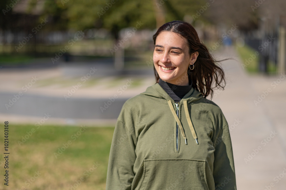 Portrait of young woman with happy expression looking to the side Portrait of young woman with happy expression looking to the side
